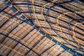 Beautiful thatched roof surface detail of mixed materials pattern structure by weave pile straw with steel bars